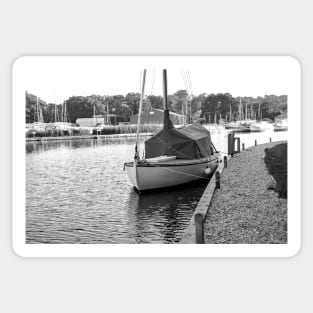 Traditional sailing boat moored up on the River Ant in the Norfolk Broads Sticker